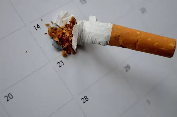 a cigarette being stumped out