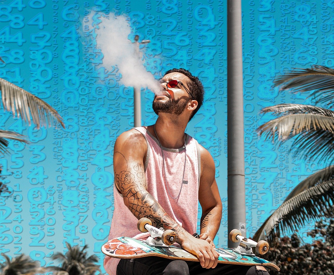 man with a pink t-shirt holding a skate board and vaping