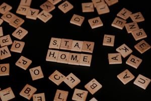 Scrabble pieces reading 'Stay Home'