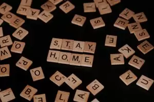 Scrabble pieces reading 'Stay Home'