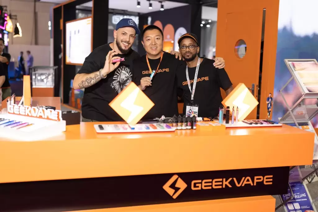 geekvape team posing for a photo in front of their exhibition stand