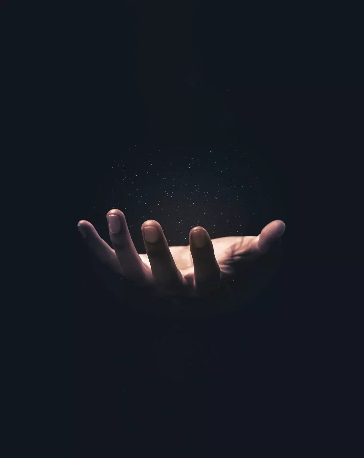 Praying hands with faith in religion and belief in God on blessing background. Power of hope or love and devotion. Magic powder floating on the magician hand