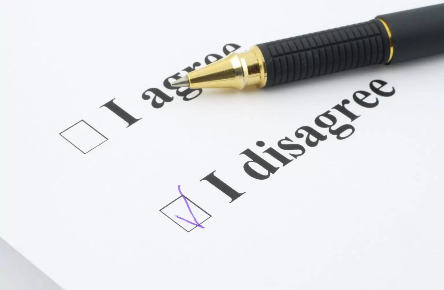 tick box survey with pen resting on i agree i disagree tix boxes