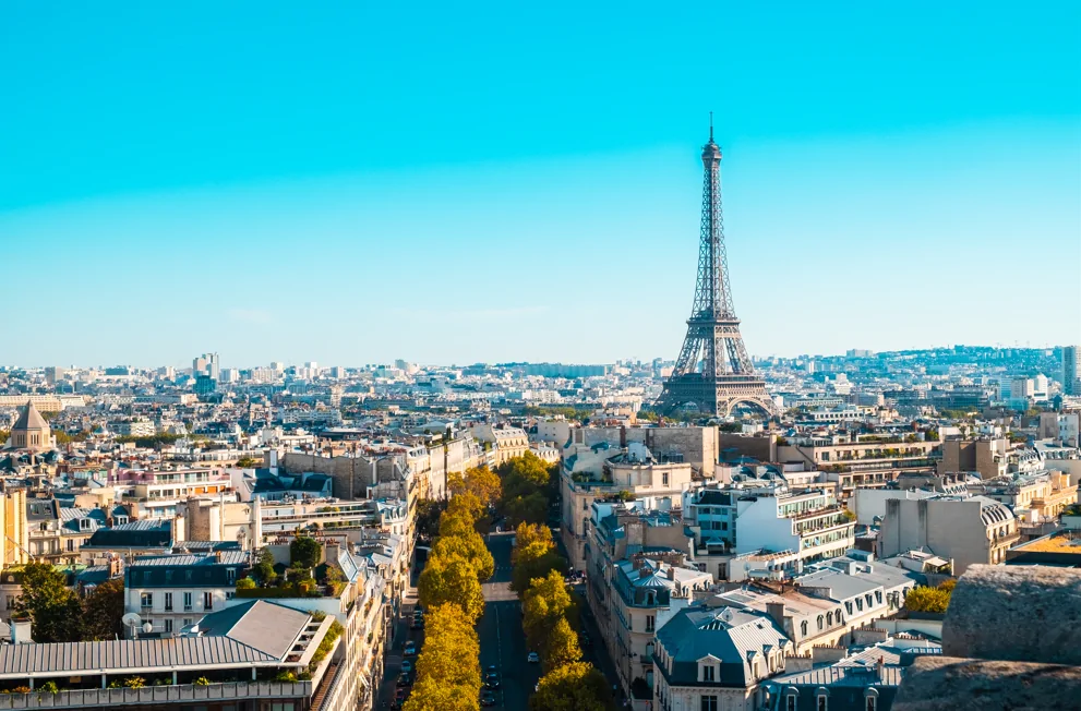 paris city skyline in the summer with blue skies and eiffel tower
