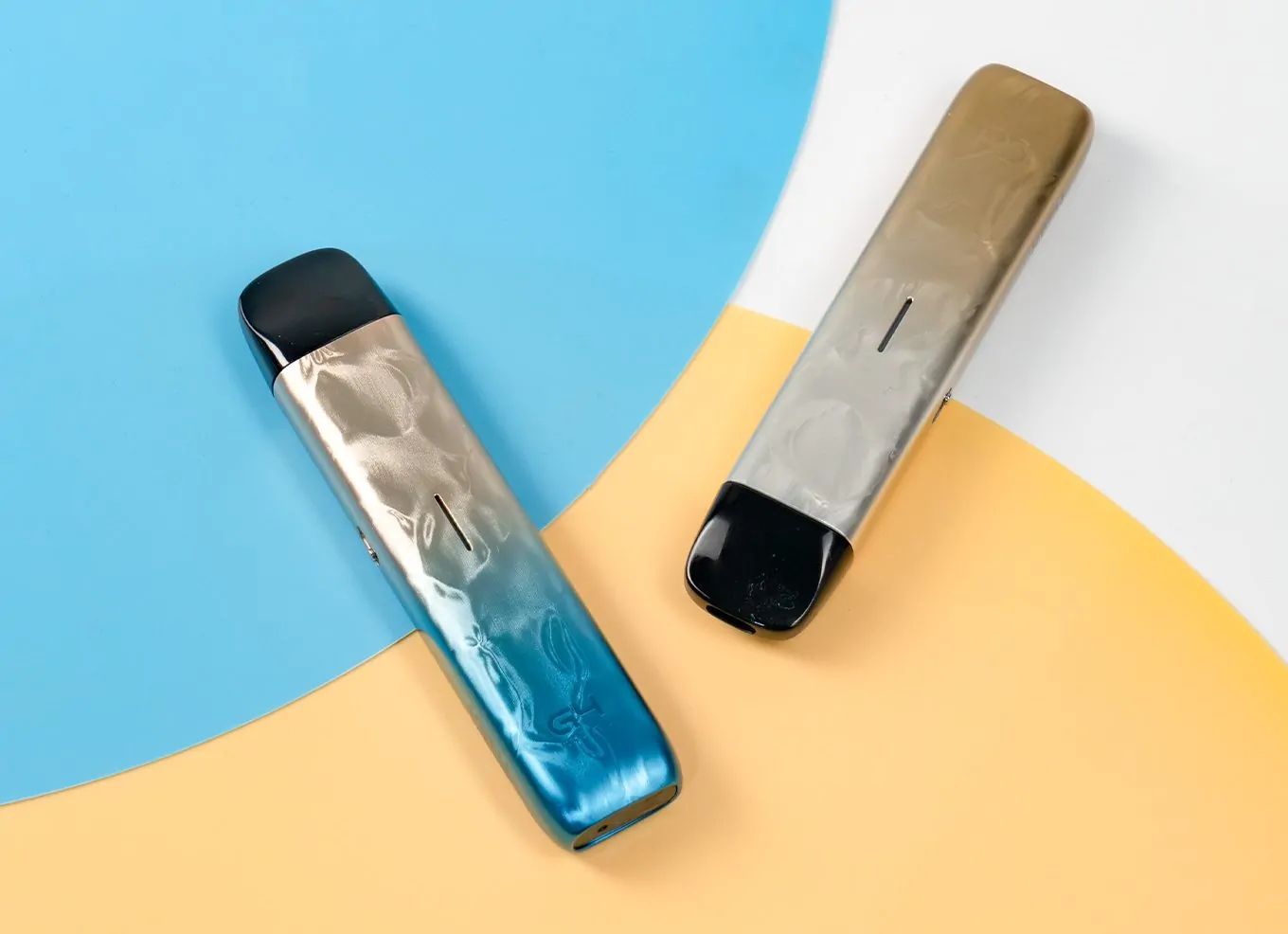 caliburn g4 mini refillable pod vape in blue and gold, on blue, orange and white card